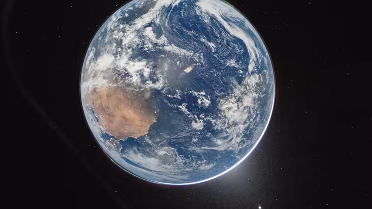Země od pólu k pólu s Afrikou a polárními zářemi z okna lodi Orion Integrity